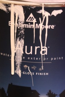 Can of paint with drips on outside