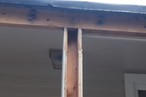 Hollow support post and exposed header beam