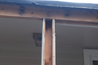 Hollow support post and exposed header beam