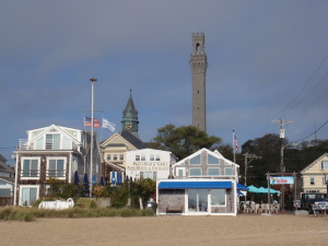 View of Provincetown, Mass., from the beach showing the Pilgrim Monument and spire of Town Hall